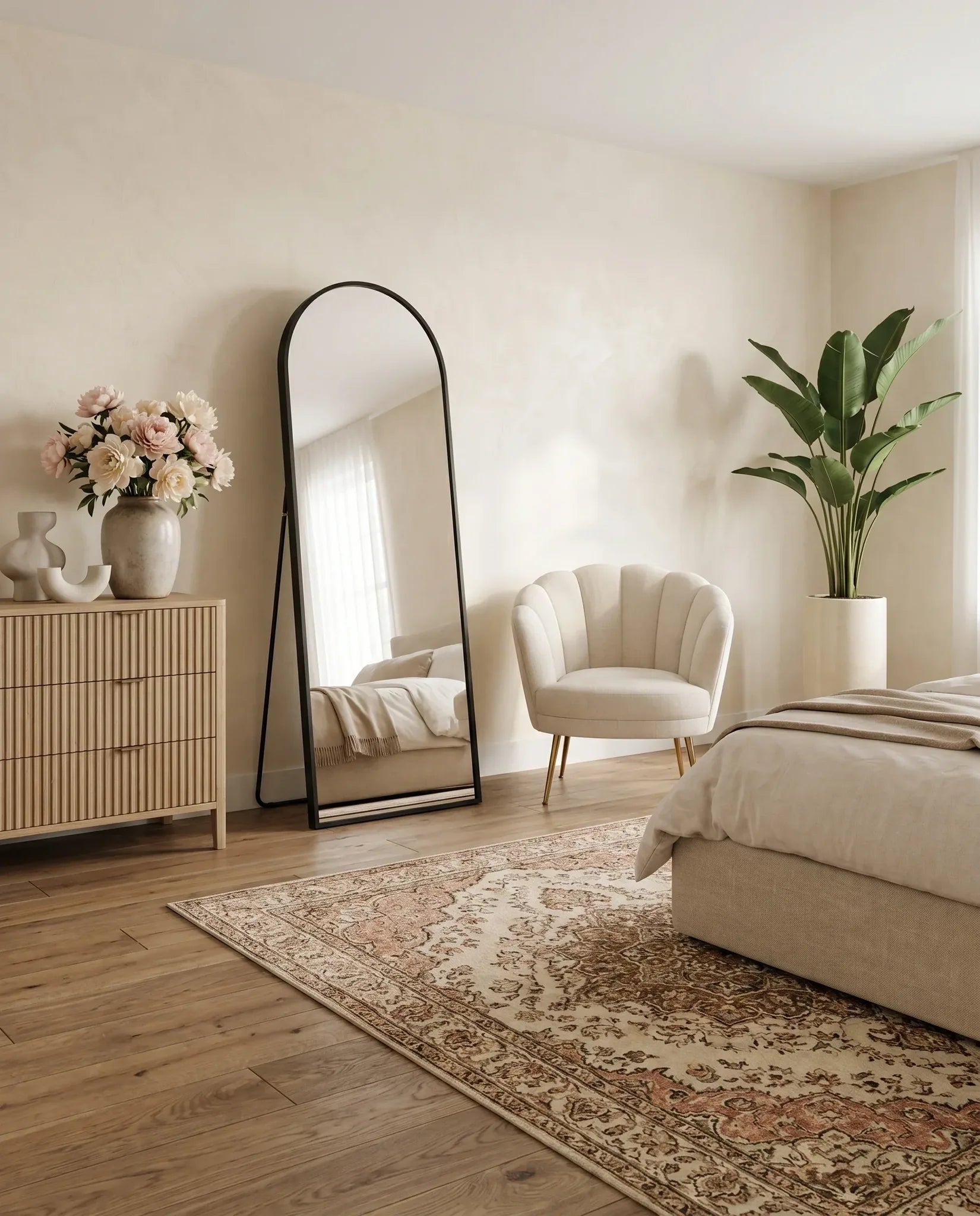 Adriana slim arch black standing mirror in a Dubai bedroom