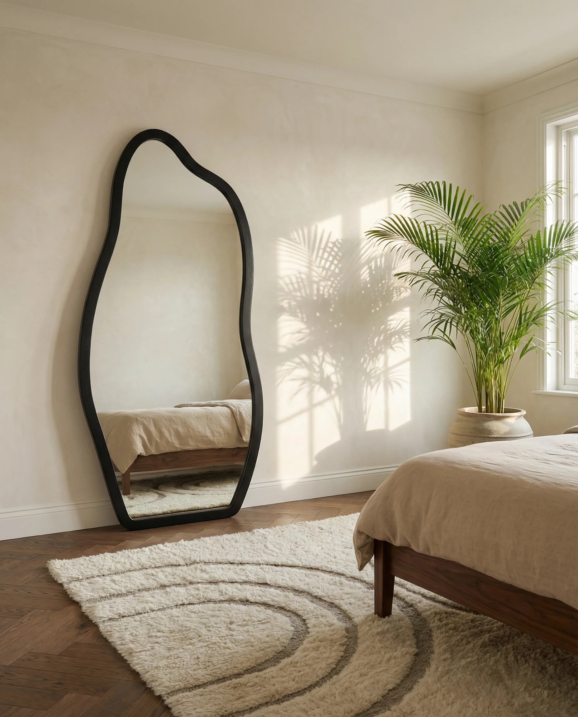 Cassie black irregular floor mirror in a Dubai bedroom