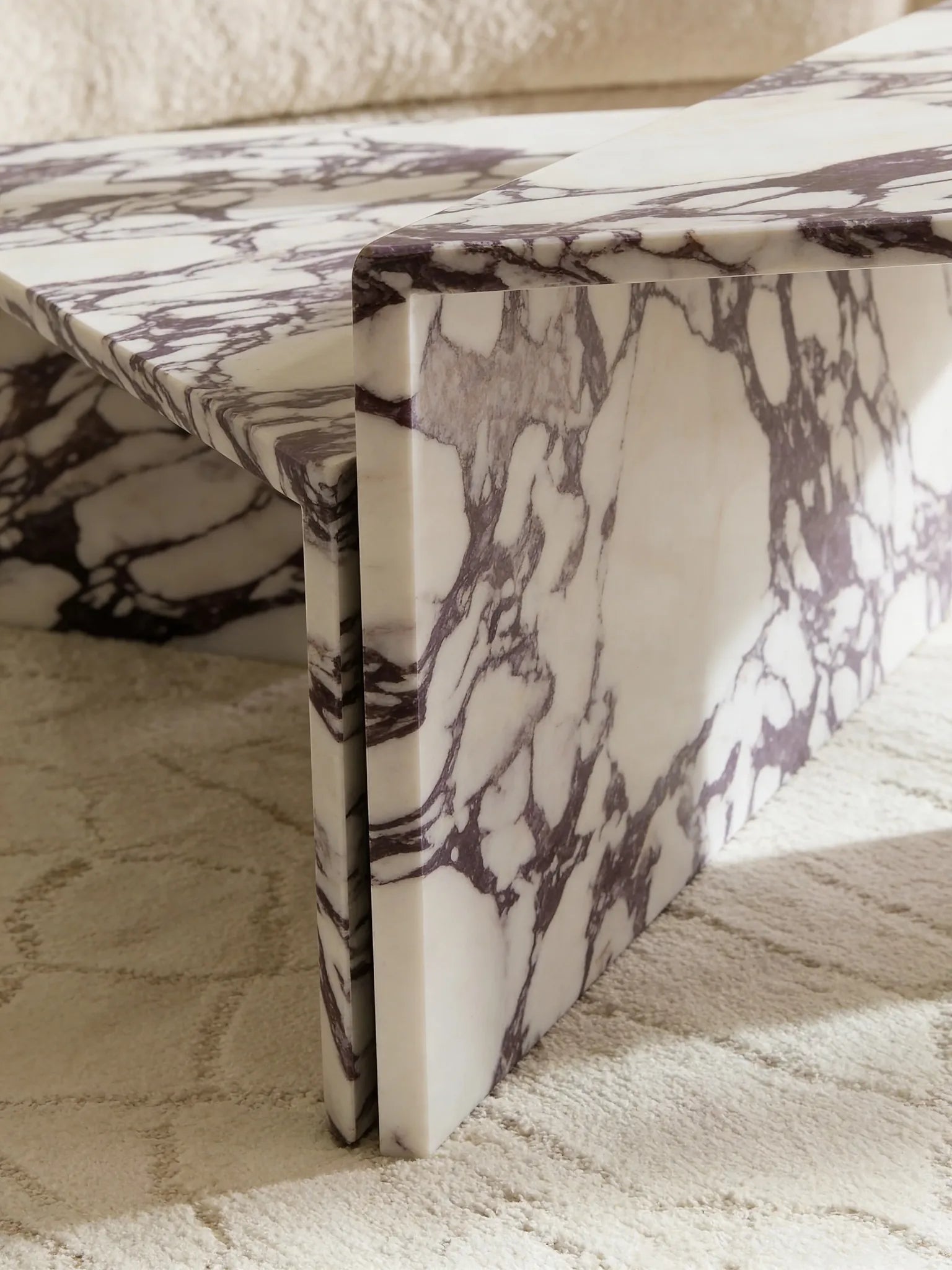 Free-form Calacatta Viola coffee table in a Dubai living room
