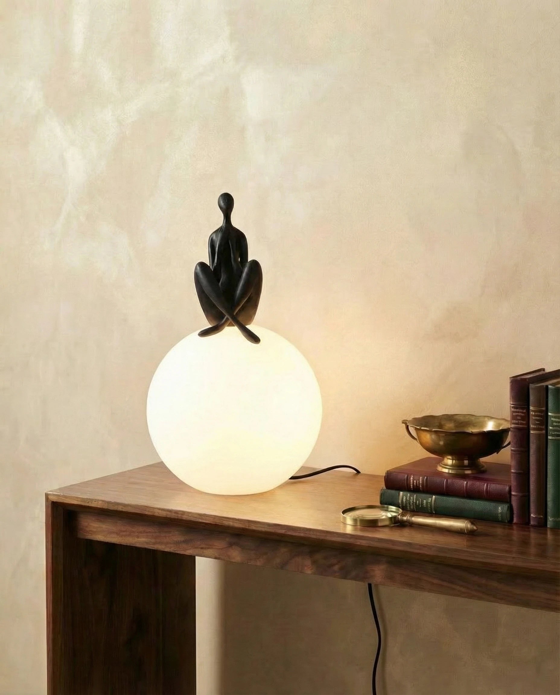 Glowing Sphere Table Lamp with Sitting Human Figurine