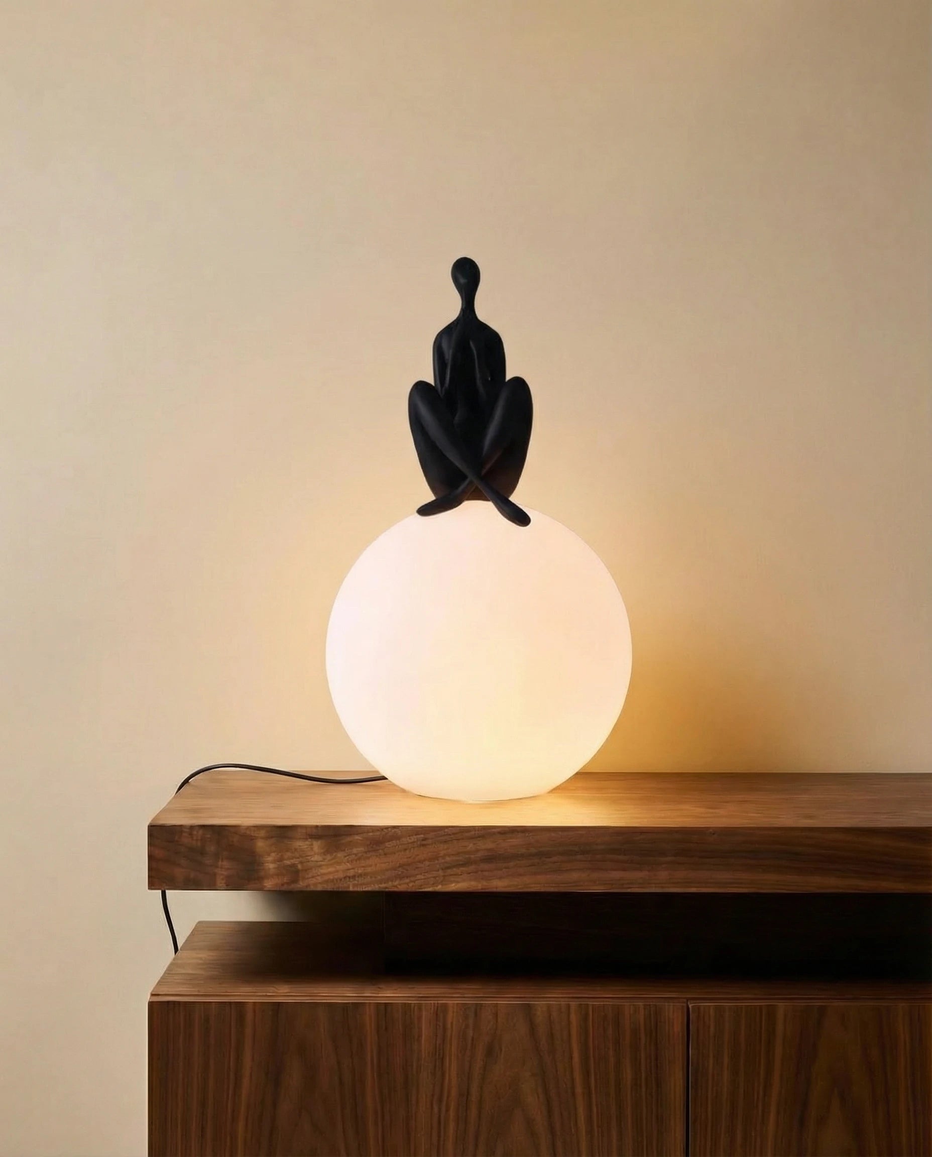 Glowing Sphere Table Lamp with Sitting Human Figurine