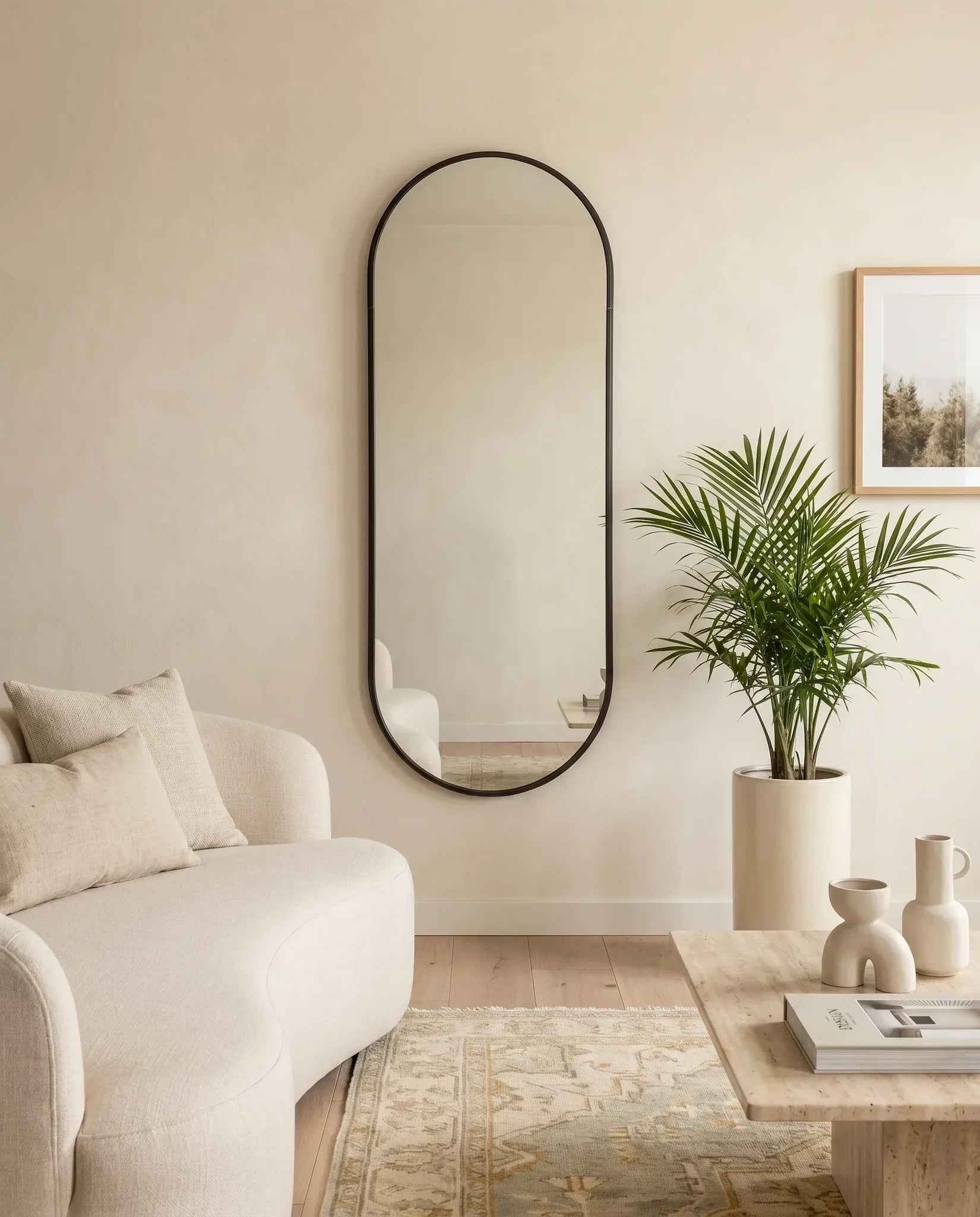 Gothic black capsule mirror, close-up of the slim frame