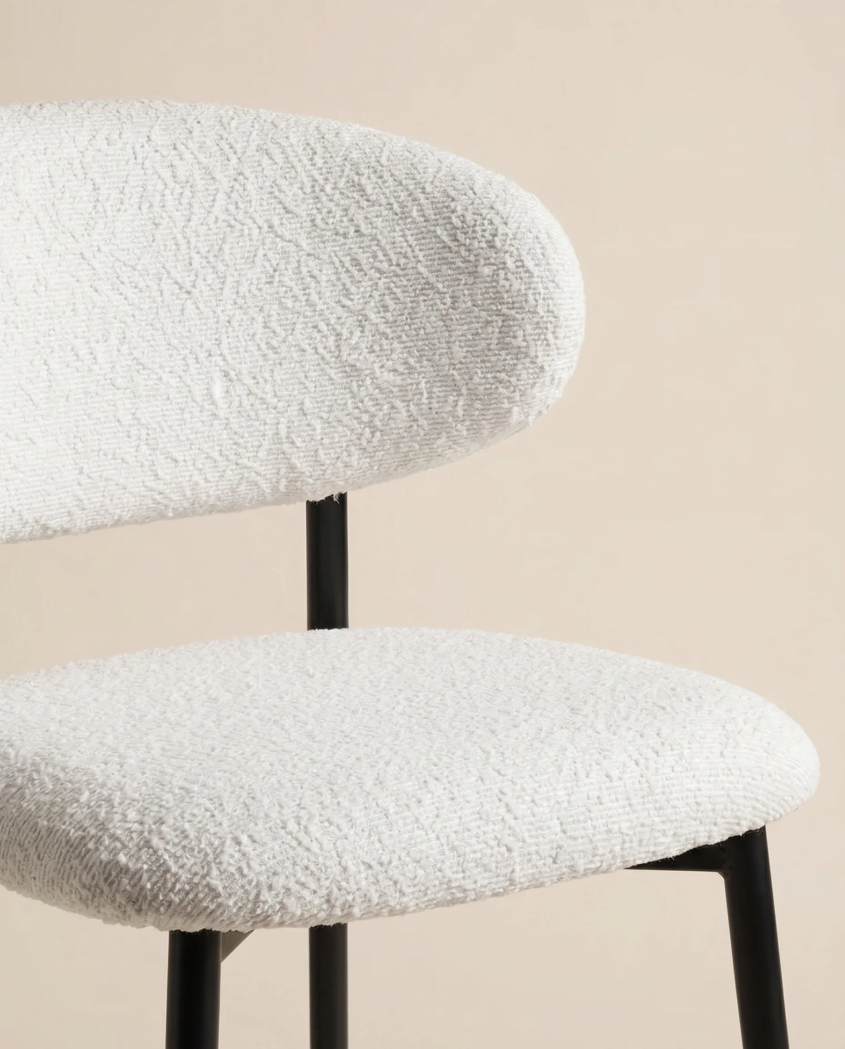 White bouclé bar stool, close-up of the looped back