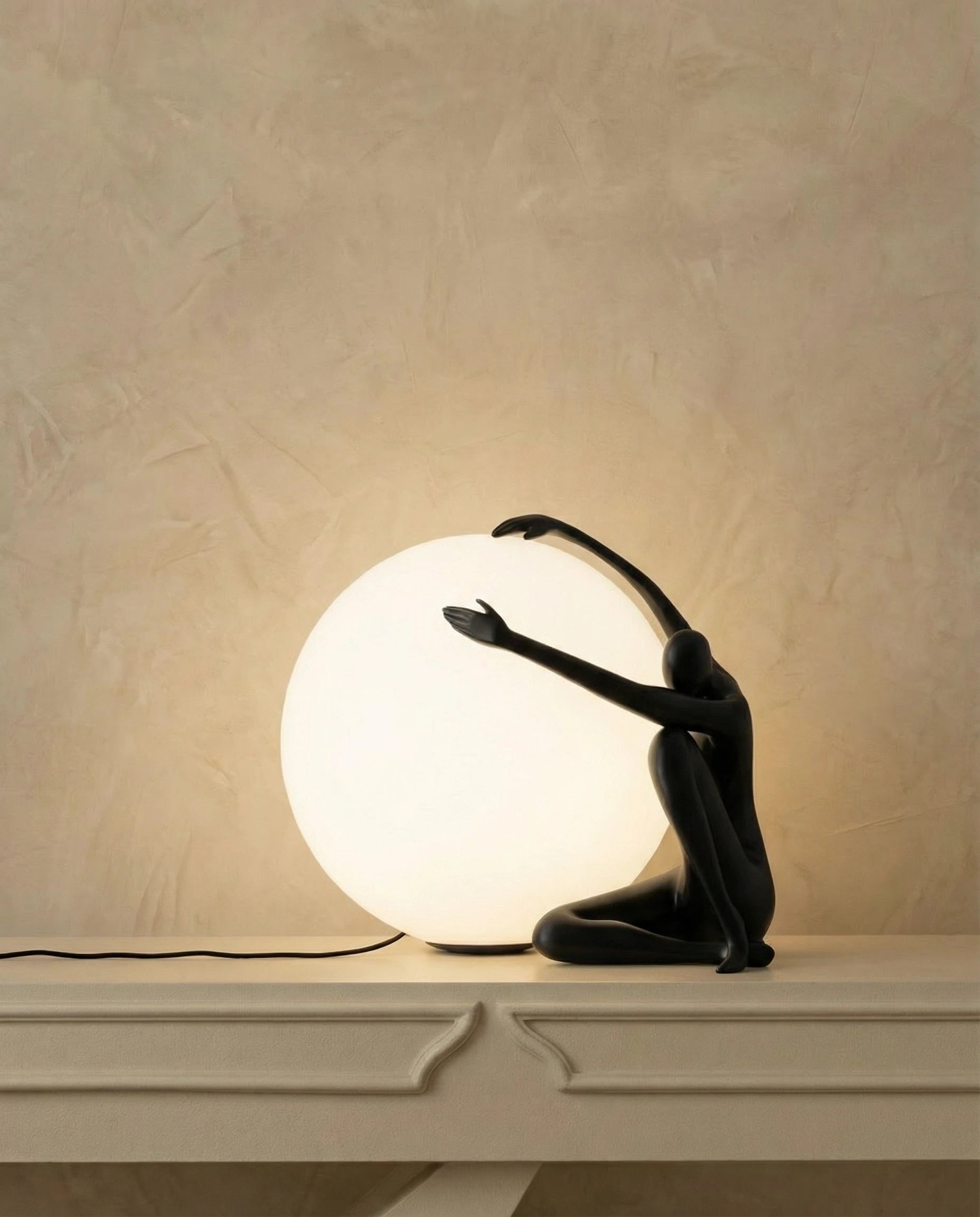 Human Figurine Holding Glowing Sphere Table Lamp