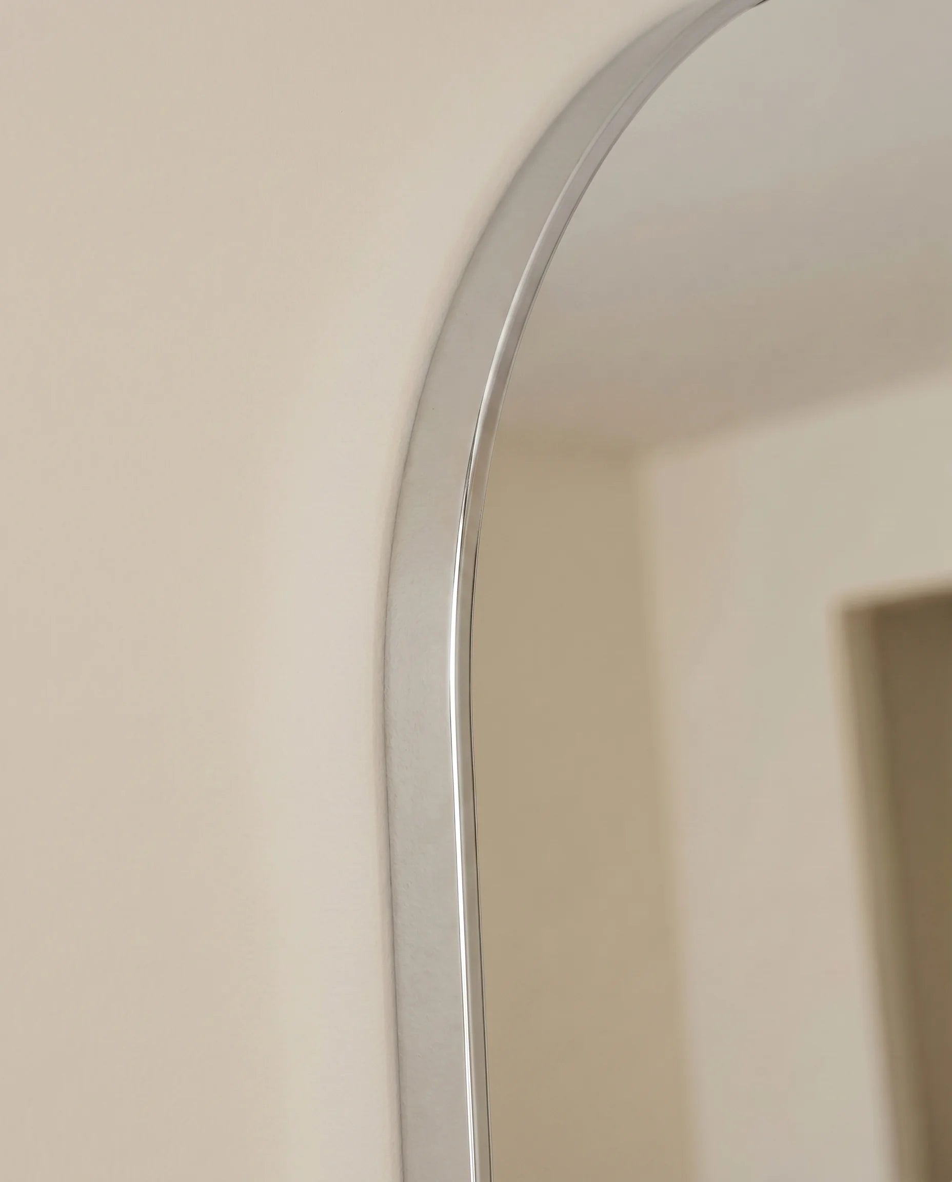 Juliette tall silver arch mirror, close-up of the slim frame