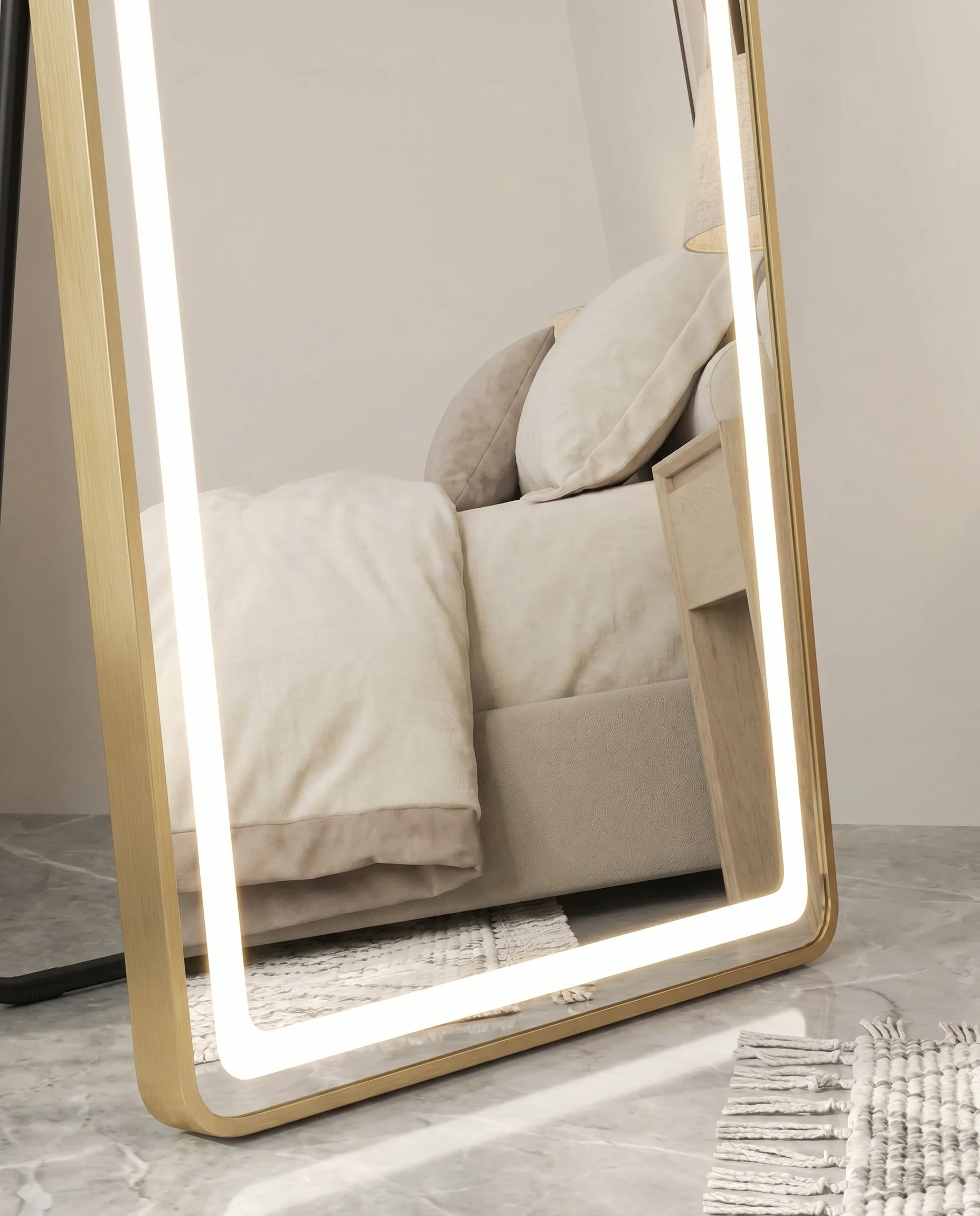 Juliette gold LED arch standing mirror, close-up of the lit frame