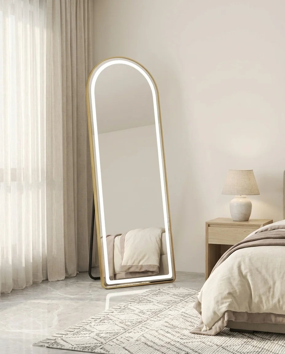 Juliette gold LED arch standing mirror in a Dubai bedroom