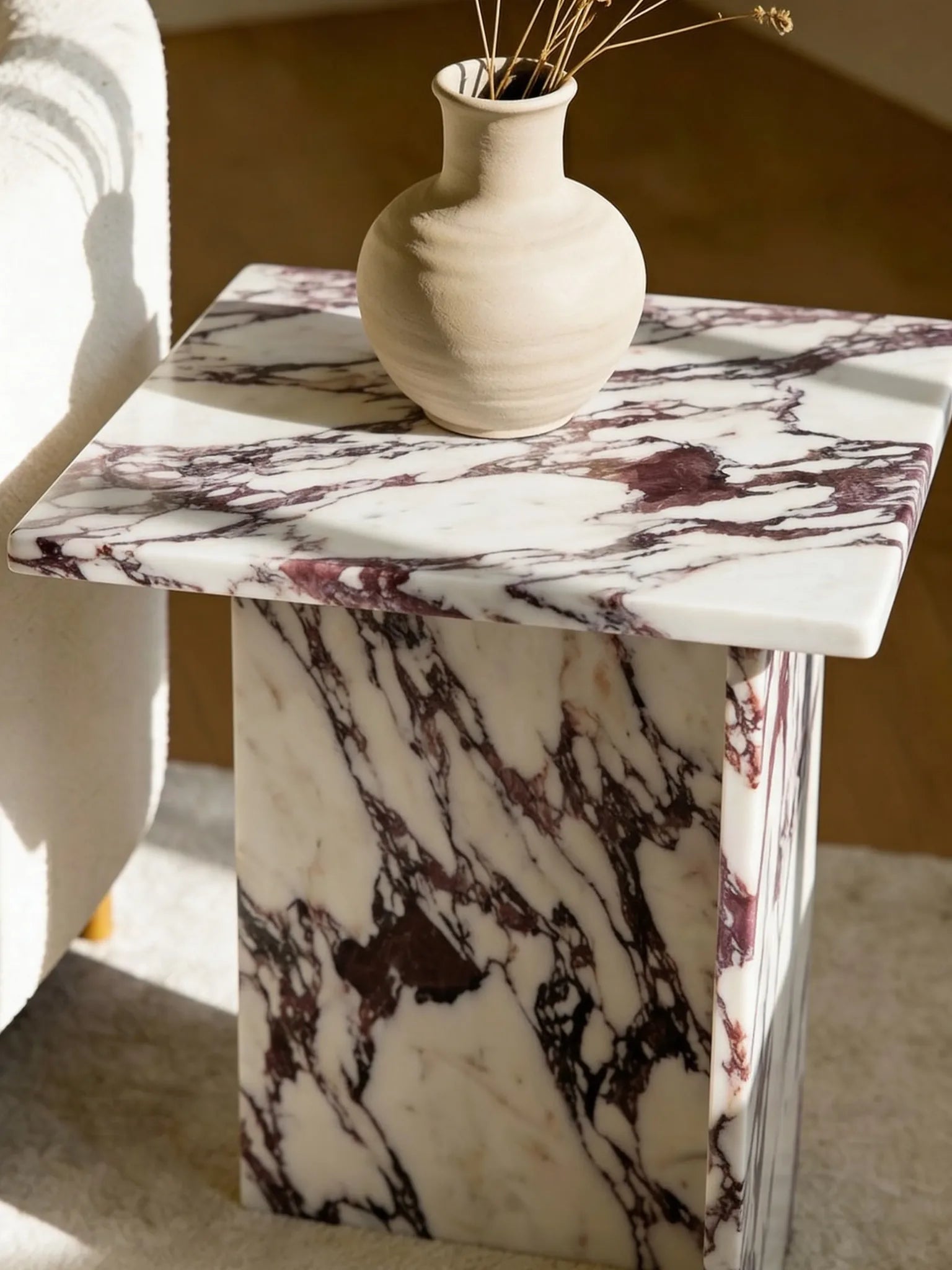 Calacatta marble side table, close-up of the grey veining