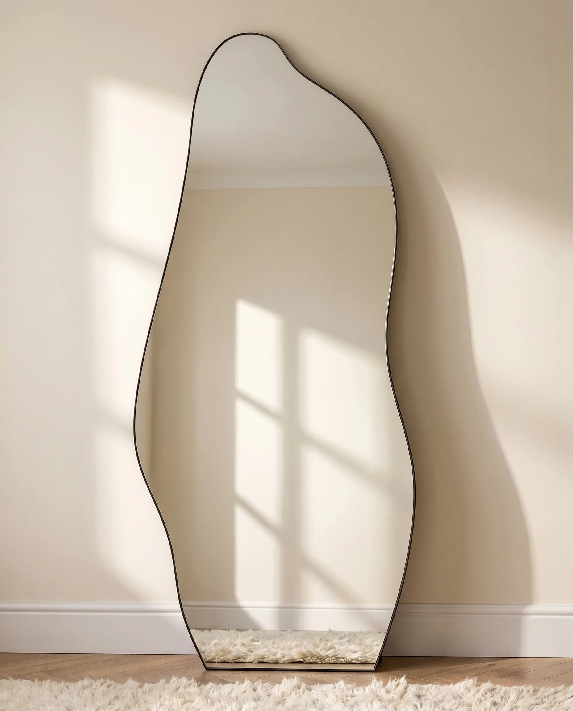 Olenna black LED irregular mirror, close-up of the lit frame