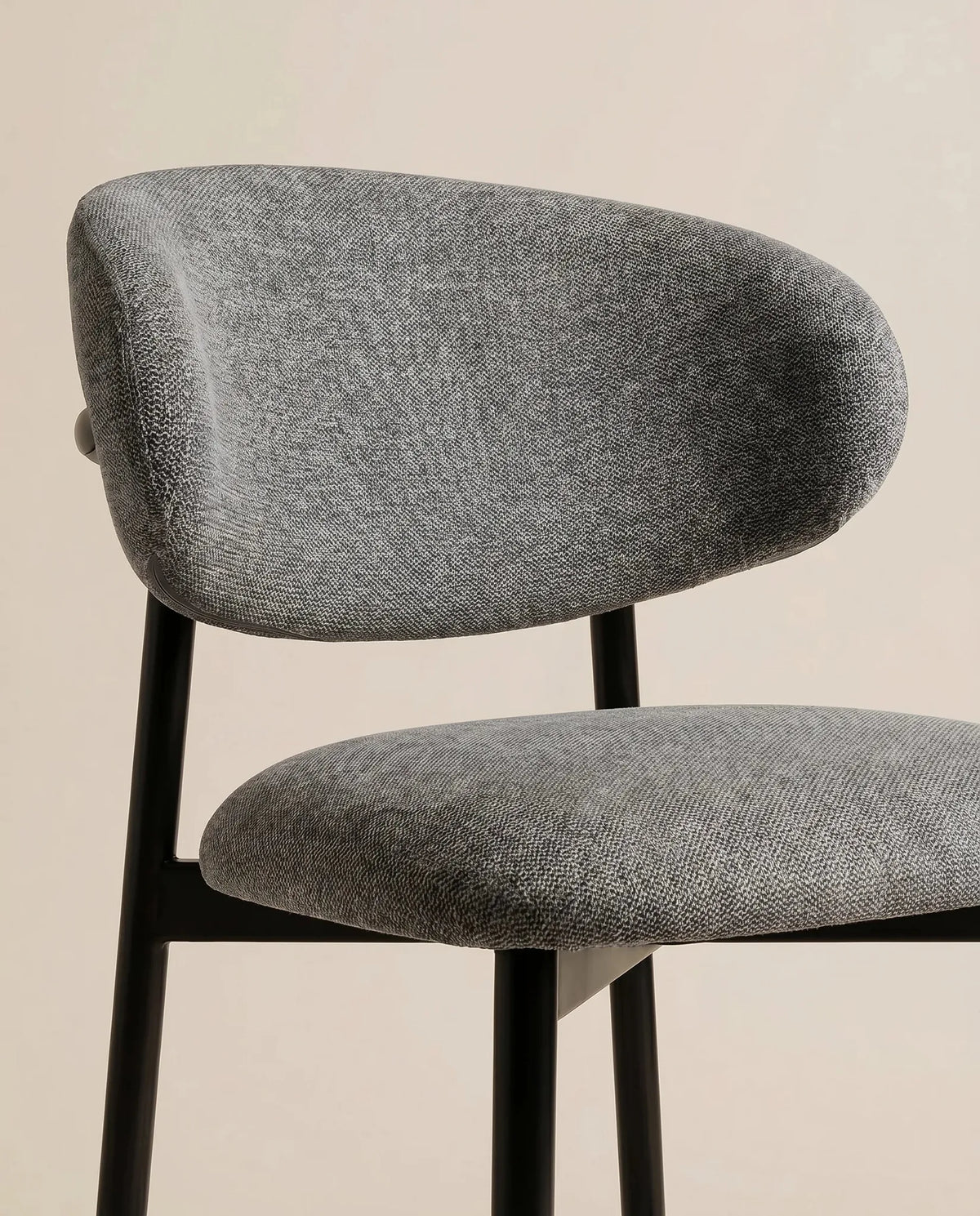Charcoal bar stool, close-up of the plush seat