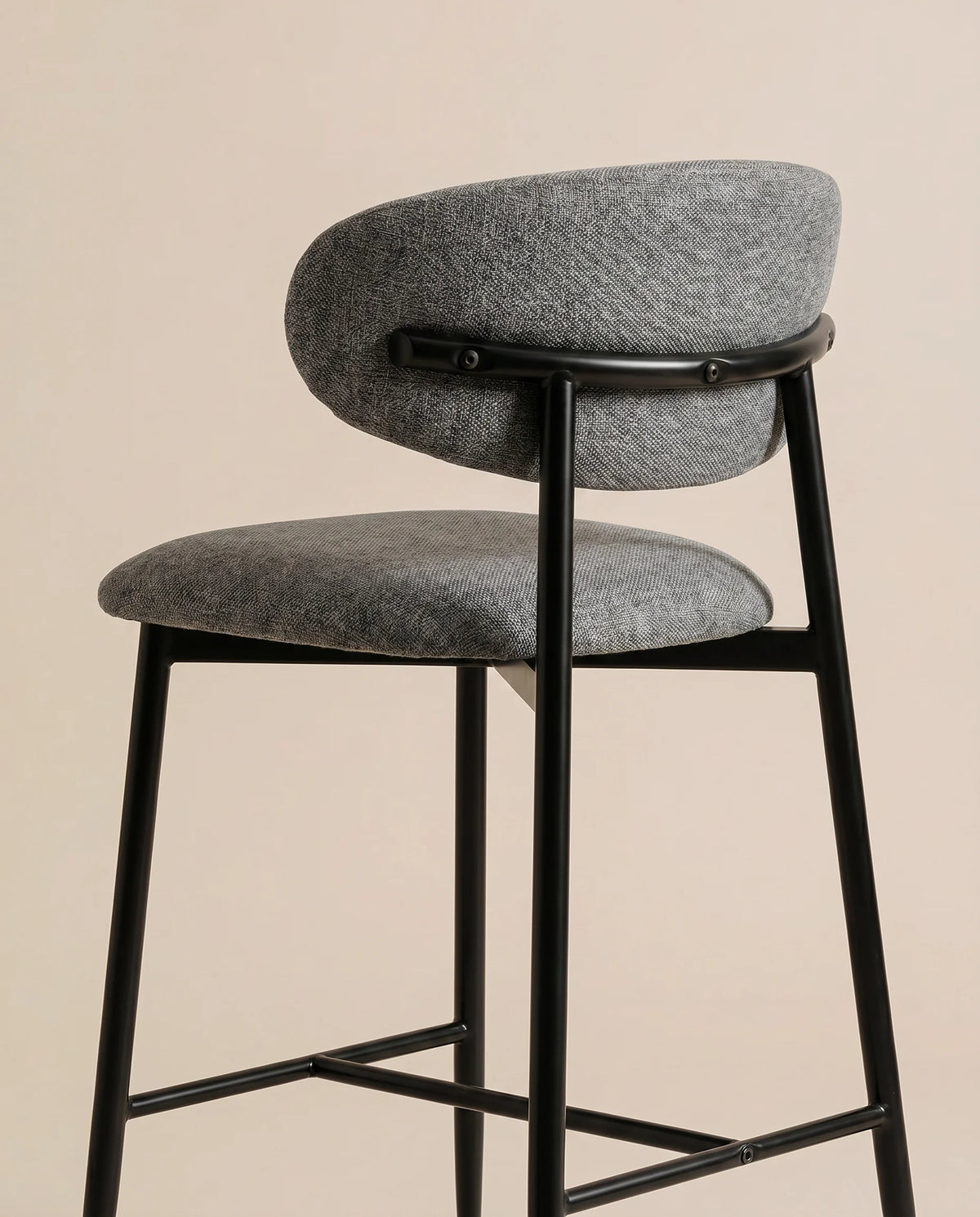 Onyx charcoal upholstered bar stool at a Dubai kitchen island