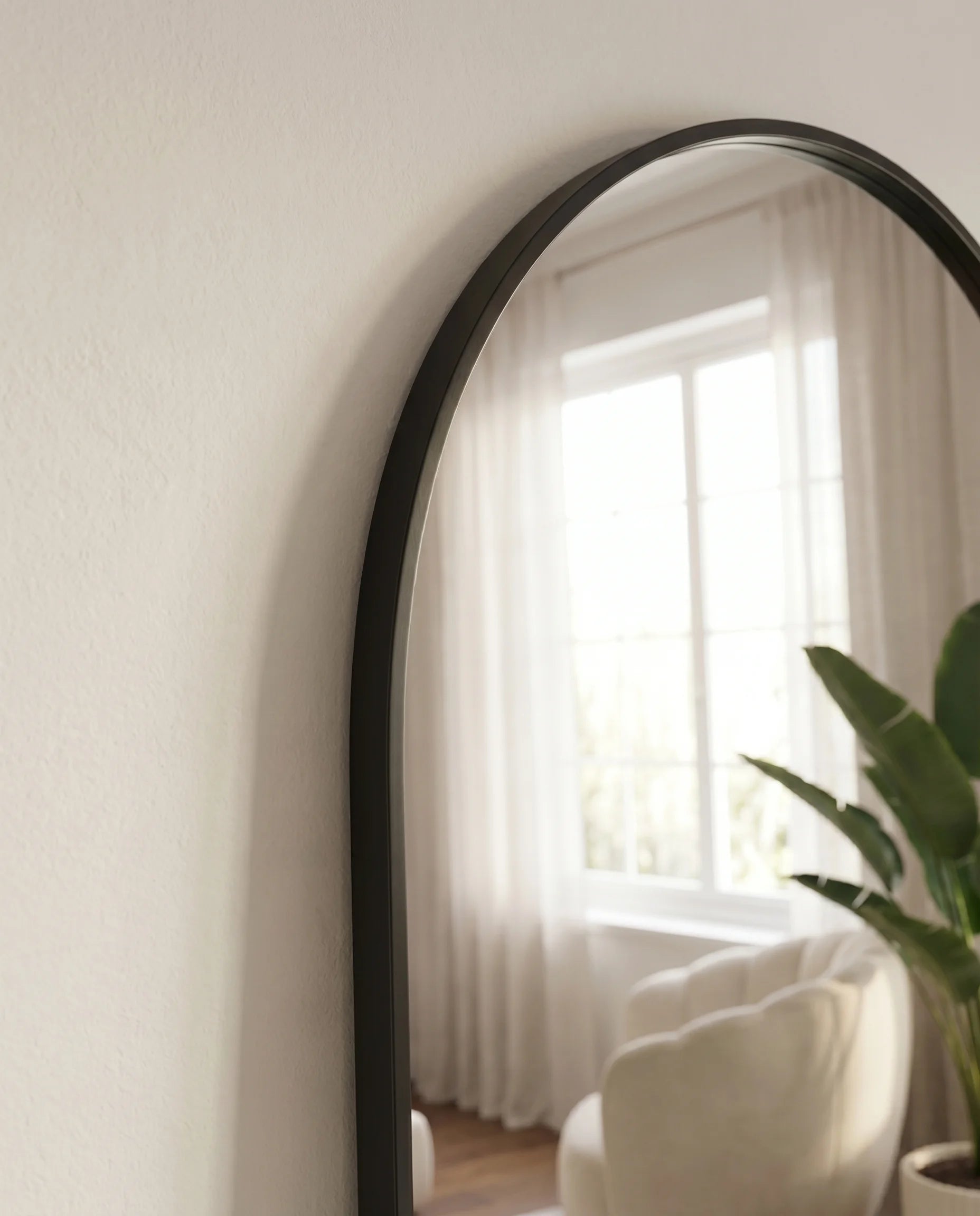 Raphael large arched black mirror, close-up of the slim frame