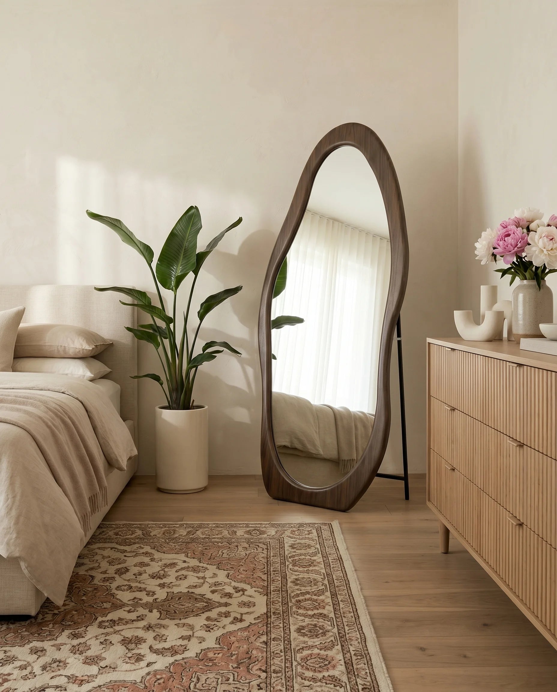 Reva wavy walnut brown mirror in a Dubai bedroom