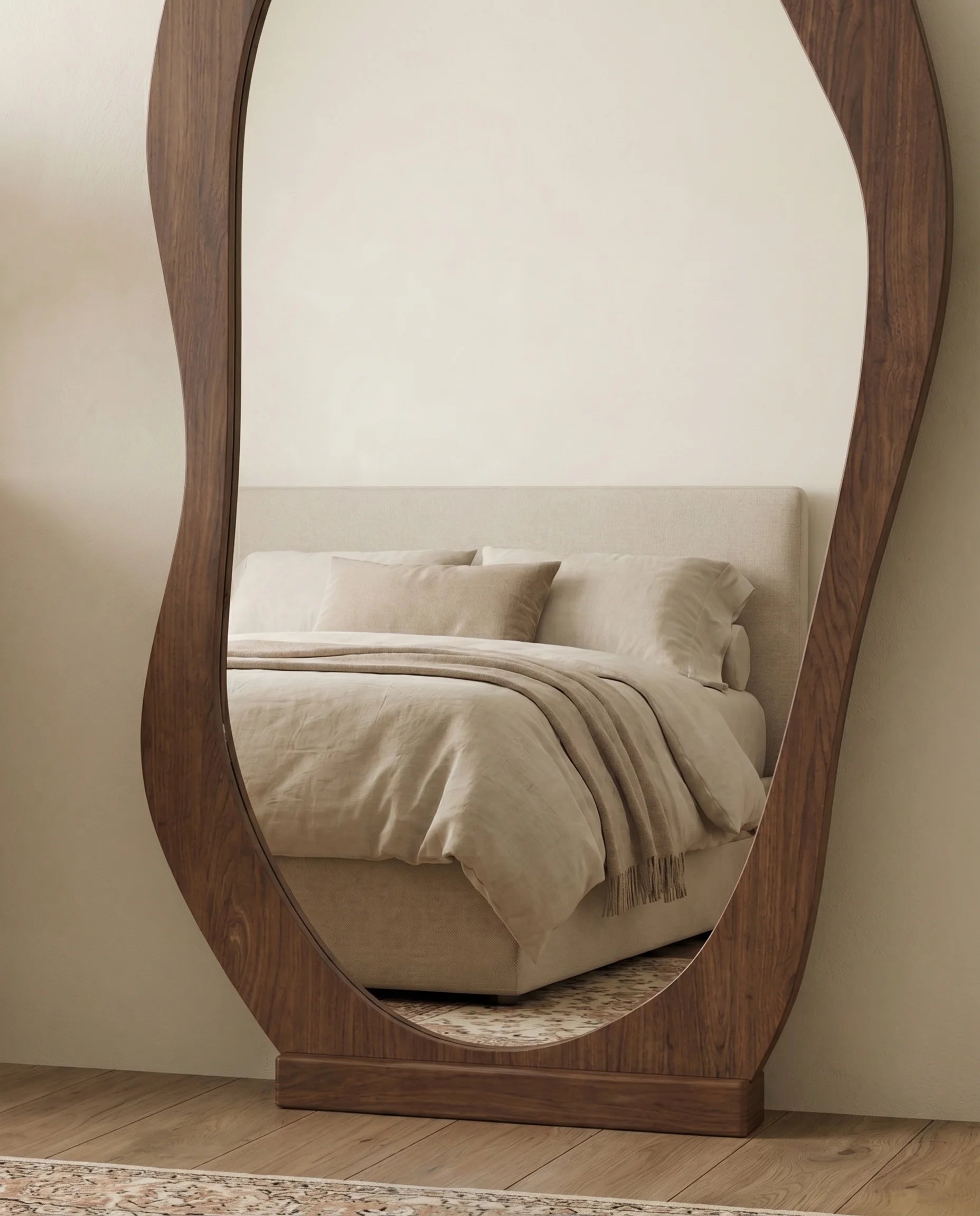 Reva wavy walnut mirror, close-up of the wood-tone frame