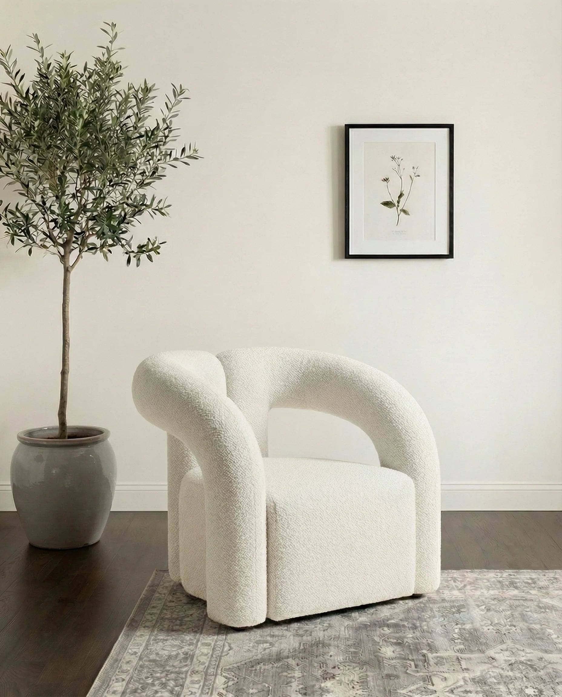 Sofia white boucle dining chair with arms in a Dubai dining room