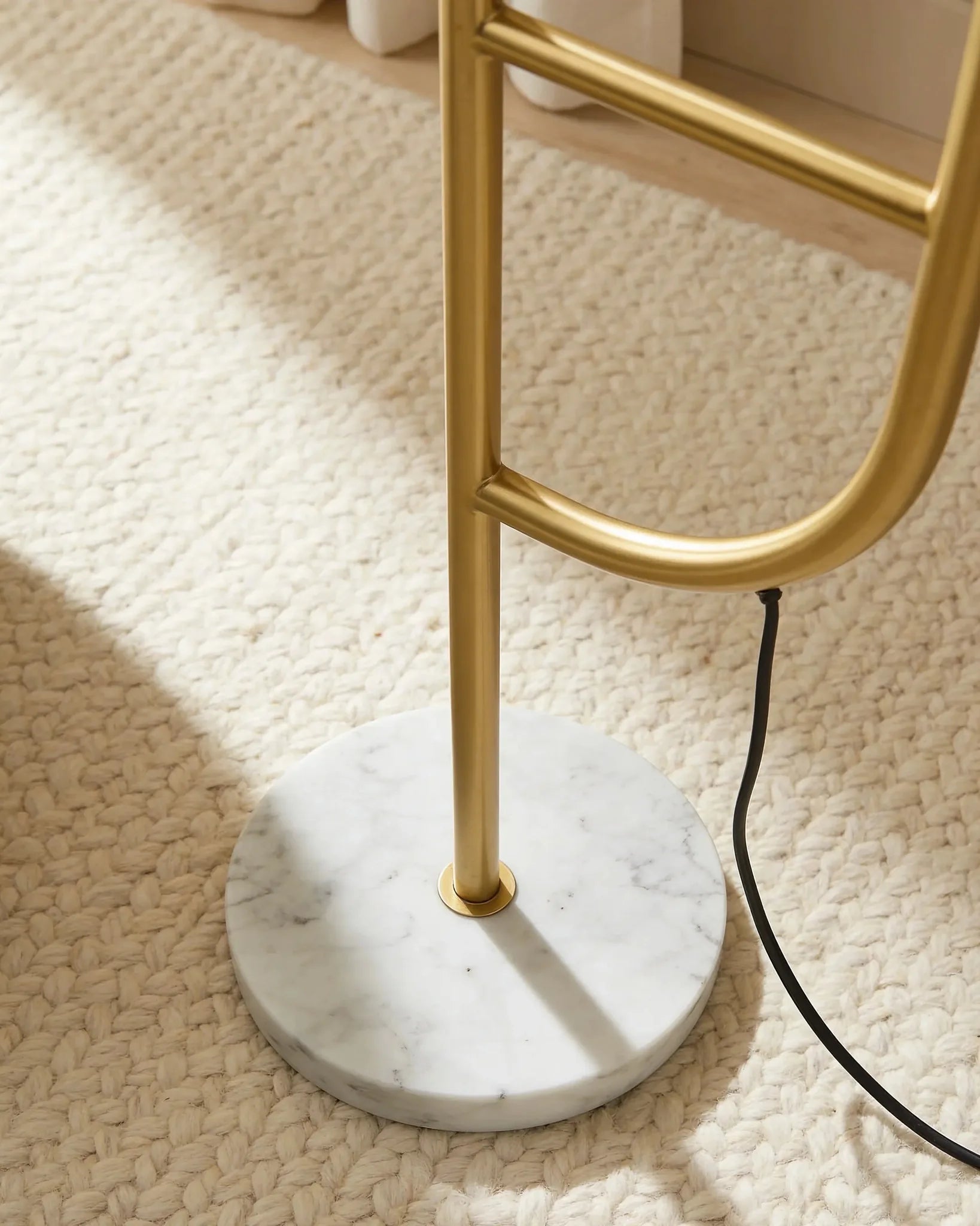 Swana gold arc floor lamp with marble side table, close-up detail