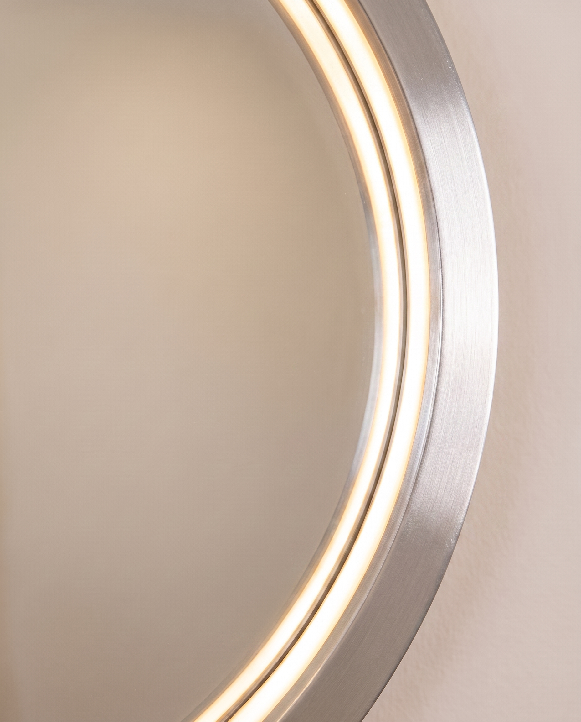 Callis silver round LED wall mirror in a Dubai bathroom