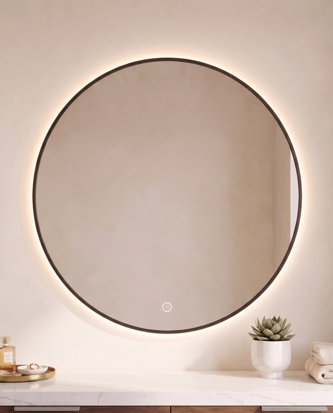Halo black round backlit wall mirror in a Dubai bathroom
