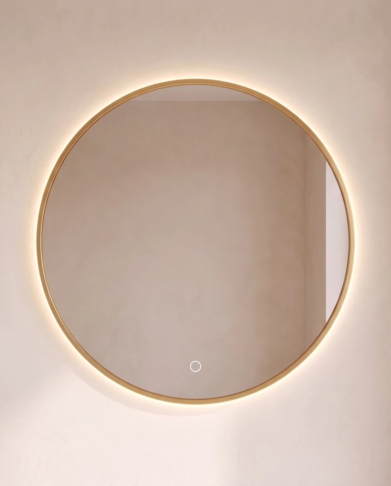 Halo gold round backlit wall mirror in a Dubai bathroom