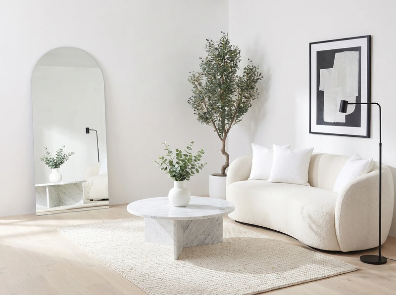 Shop The Look — arched floor mirror, marble table, olive tree, bright living room