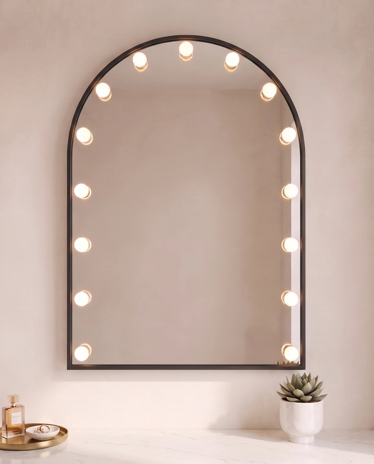 Soraya black arch wall mirror with bulbs in a Dubai bathroom